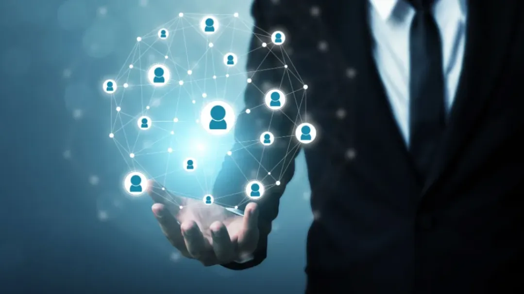 A recruiter in a suit holding a glowing digital network of connected candidate icons, symbolizing the role of technical knowledge in modern hiring processes.